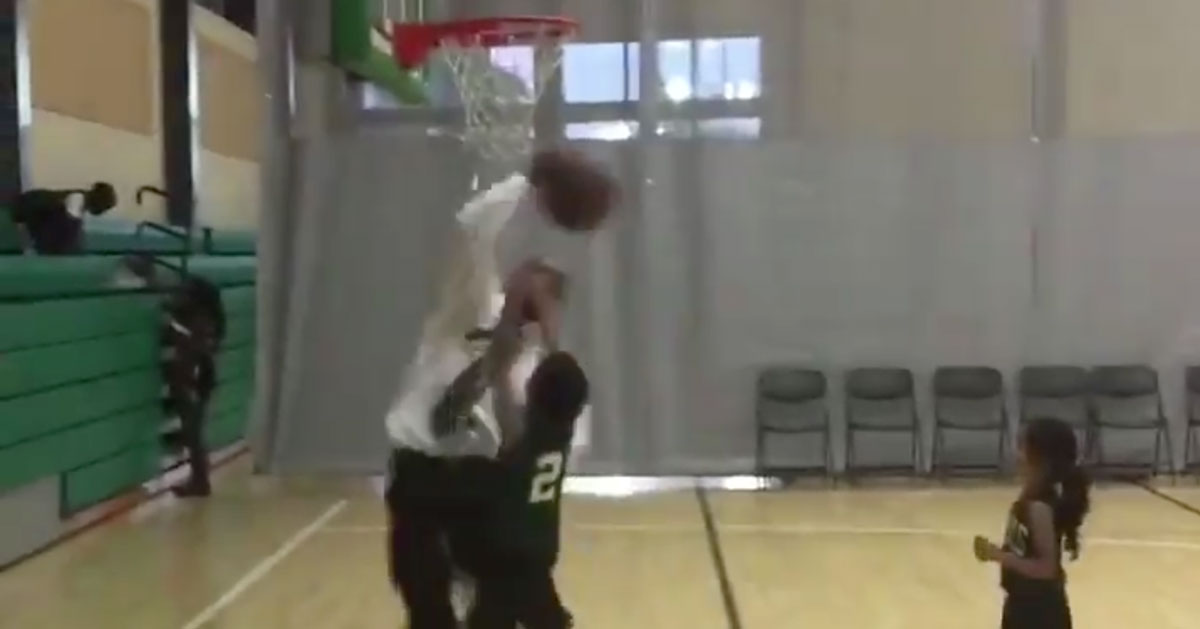 WATCH: Coach Runs Onto The Court & Blocks His Own Player's Shot