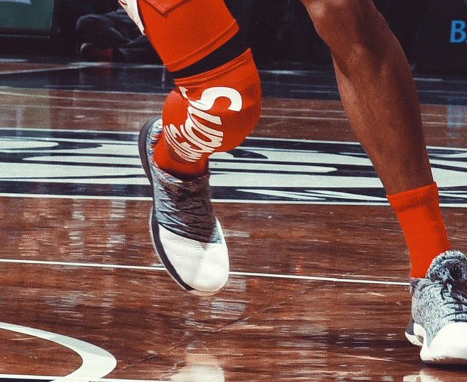 Kelly Oubre Wears Supreme Sleeve on his Leg During Game