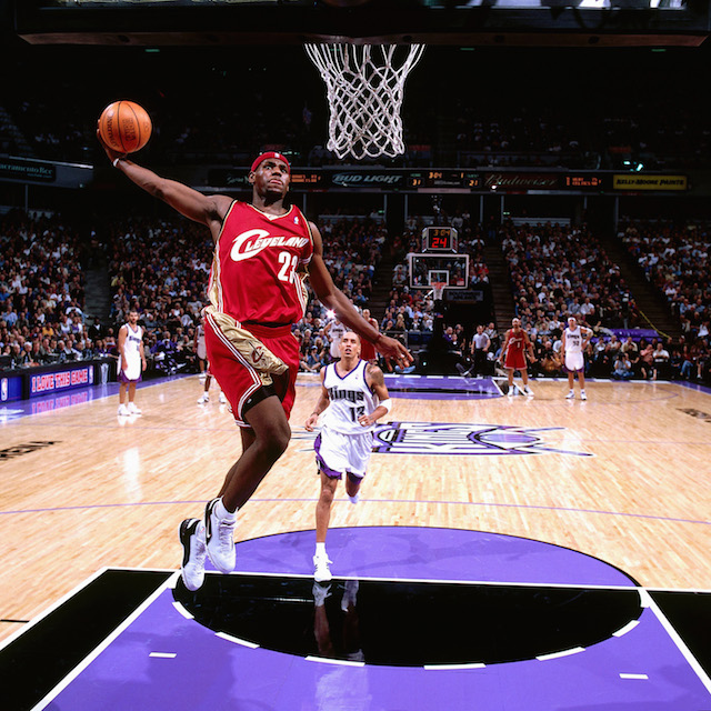 SACRAMENTO, CA - OCTOBER 29: LeBron James #23 of the Cleveland Cavaliers goes for a dunk against the Sacramento Kings during the NBA game at the Arco Arena on October 29, 2003 in Sacramento, California. NOTE TO USER: User expressly acknowledges and agrees that, by downloading and or using this photograph, User is consenting to the terms and conditions of the Getty Images License Agreement. Mandatory copyright notice: Copyright NBAE 2003 (Photo by Rocky Widner/ NBAE via Getty Images)